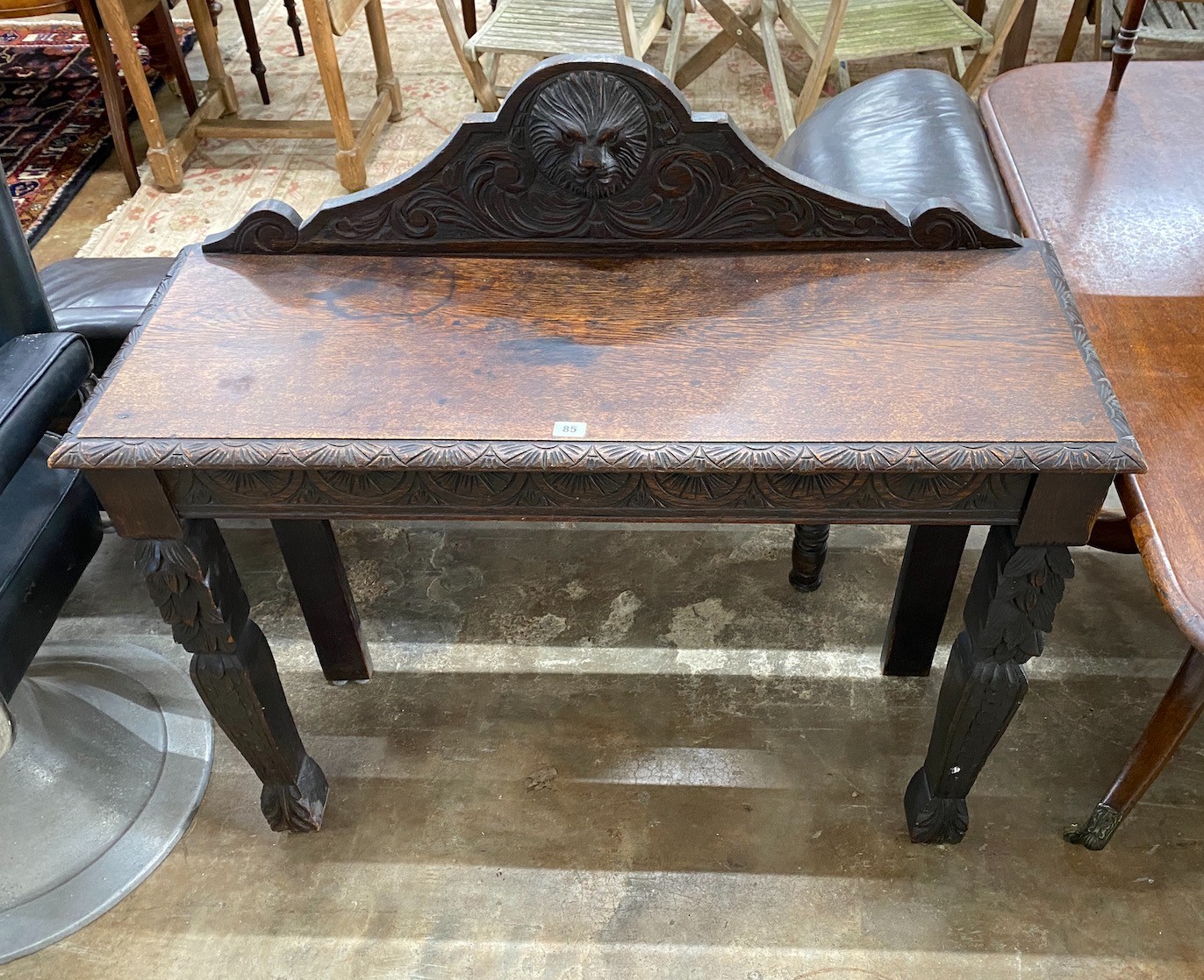 A late 19th century Flemish carved oak console table width 107cm, depth 40cm, height 100cm.
